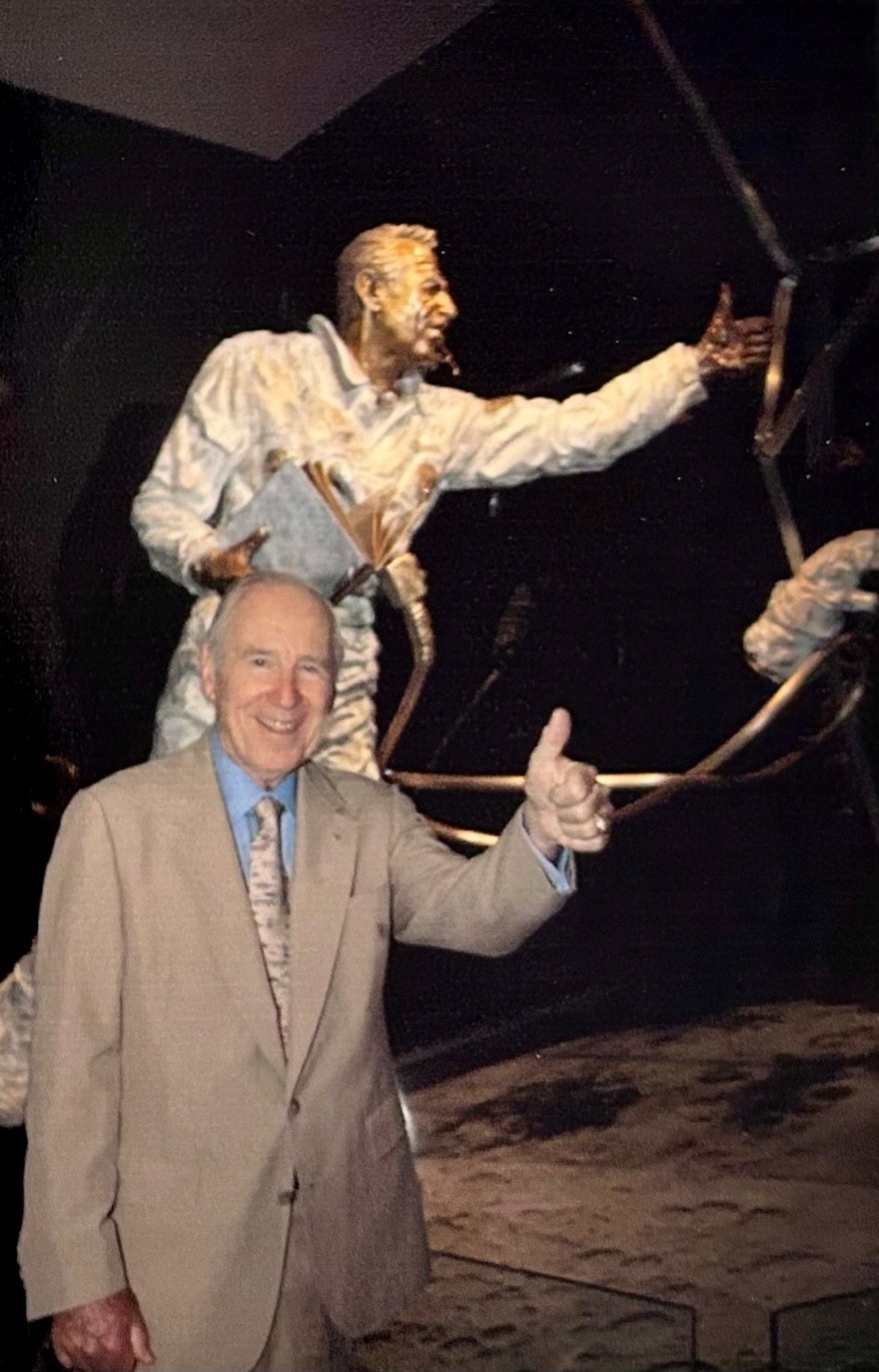 Astronaut Captain James A. Lovell standing alongside Quest for Exploration, Adler Planetarium, 2005